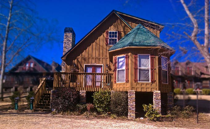 small lake house cabin with stone fireplace